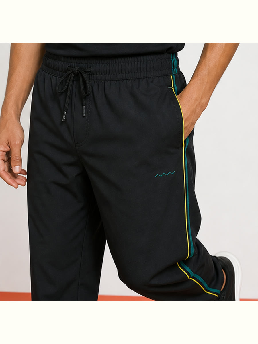 Field Notes Track Pants construction and print-detail close view.
